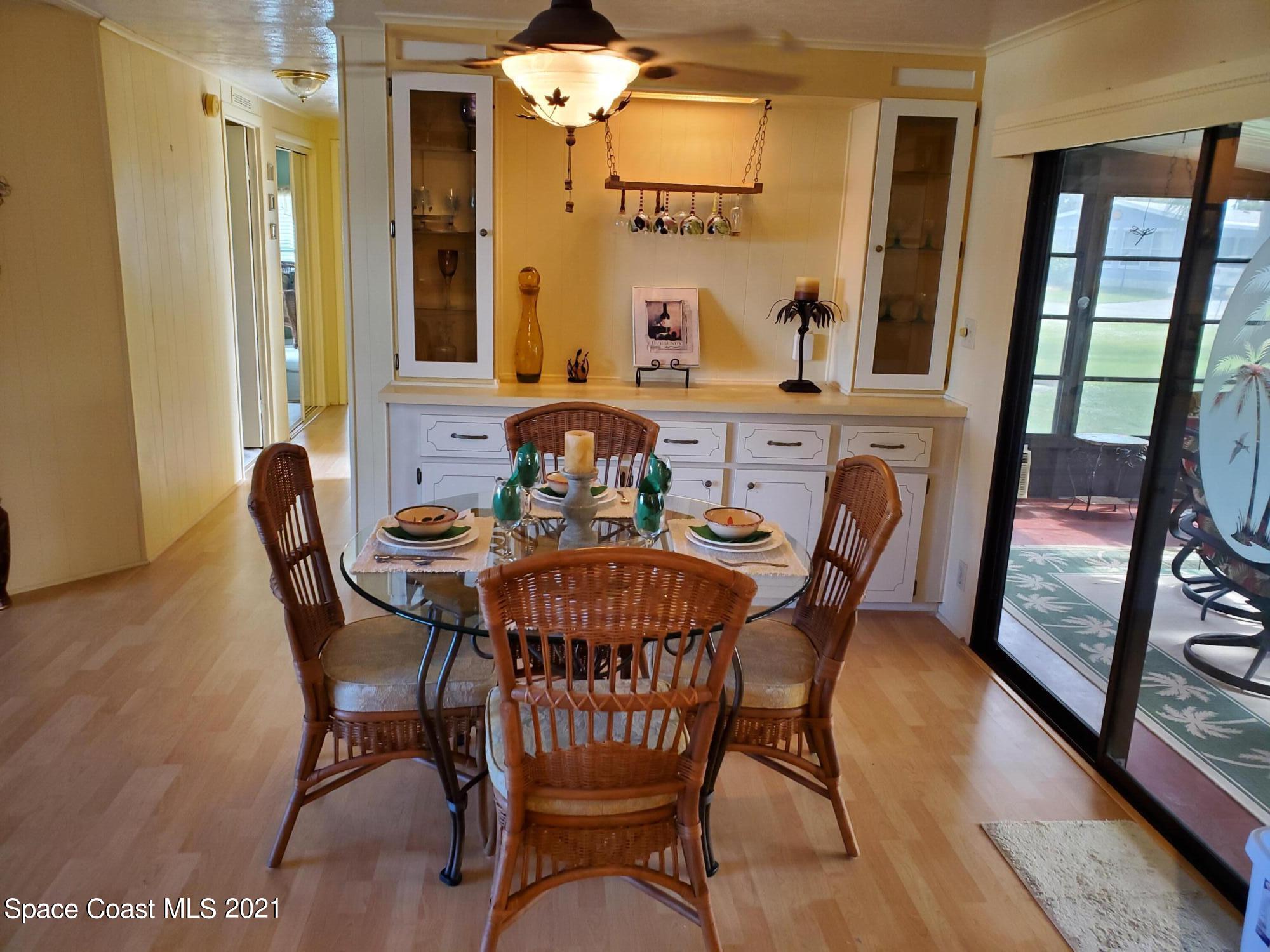 327 Macadamia Drive Sebastian, FL 32976 - Photo 12 of 31 a view of a dining room with furniture window and wooden floor