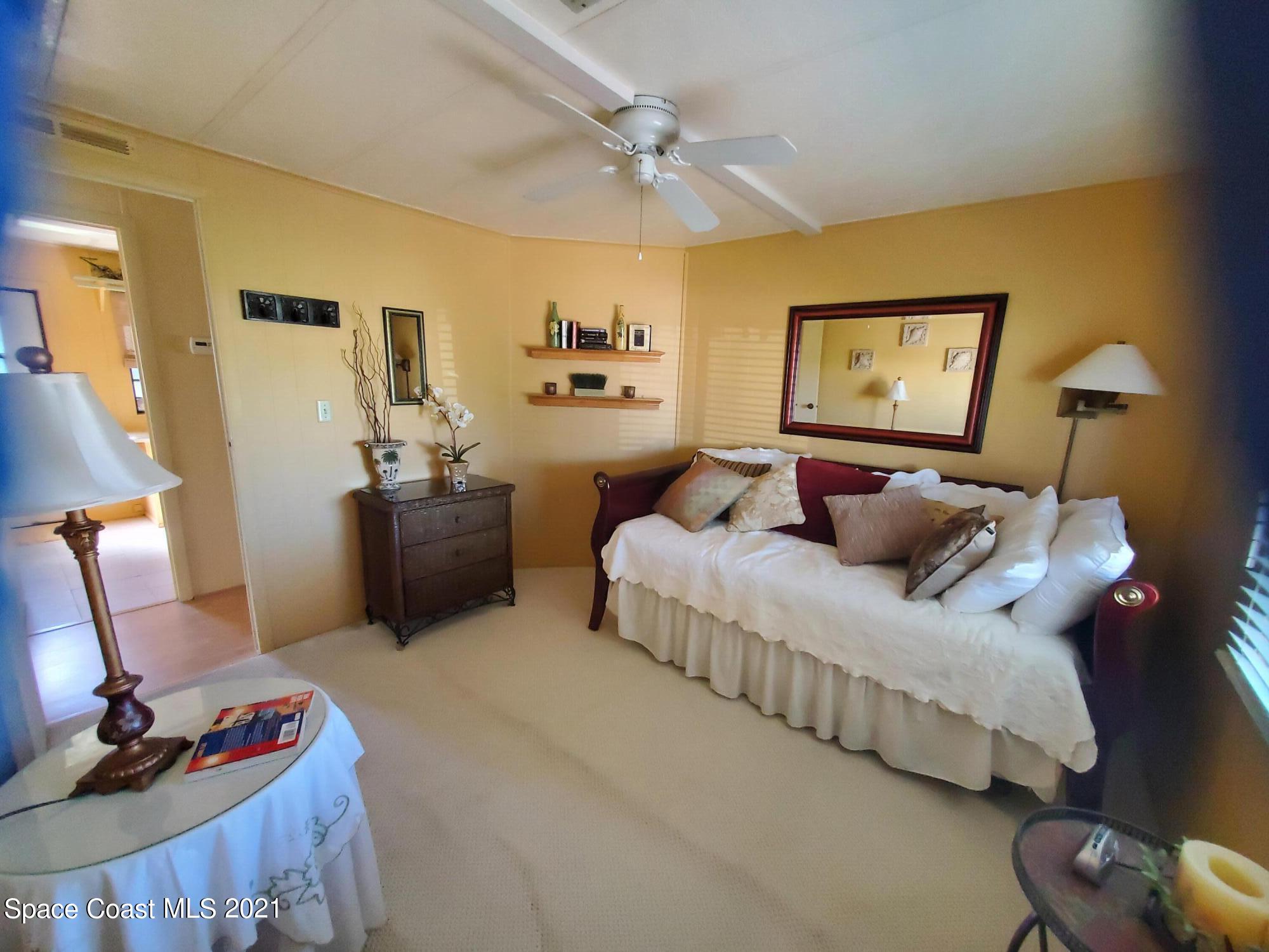327 Macadamia Drive Sebastian, FL 32976 - Photo 23 of 31 a bedroom with bed and window