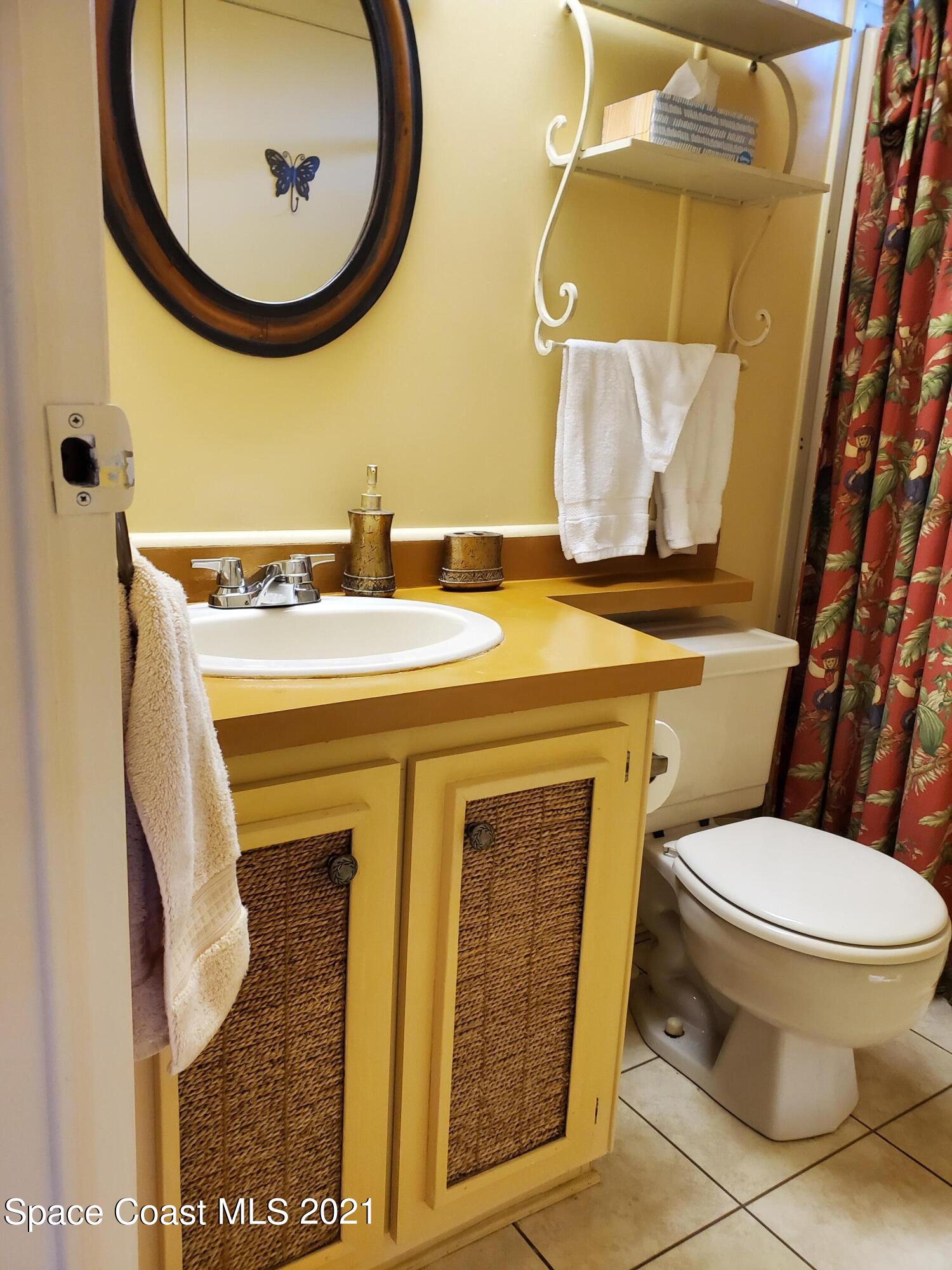 327 Macadamia Drive Sebastian, FL 32976 - Photo 24 of 31 a bathroom with a sink and a mirror