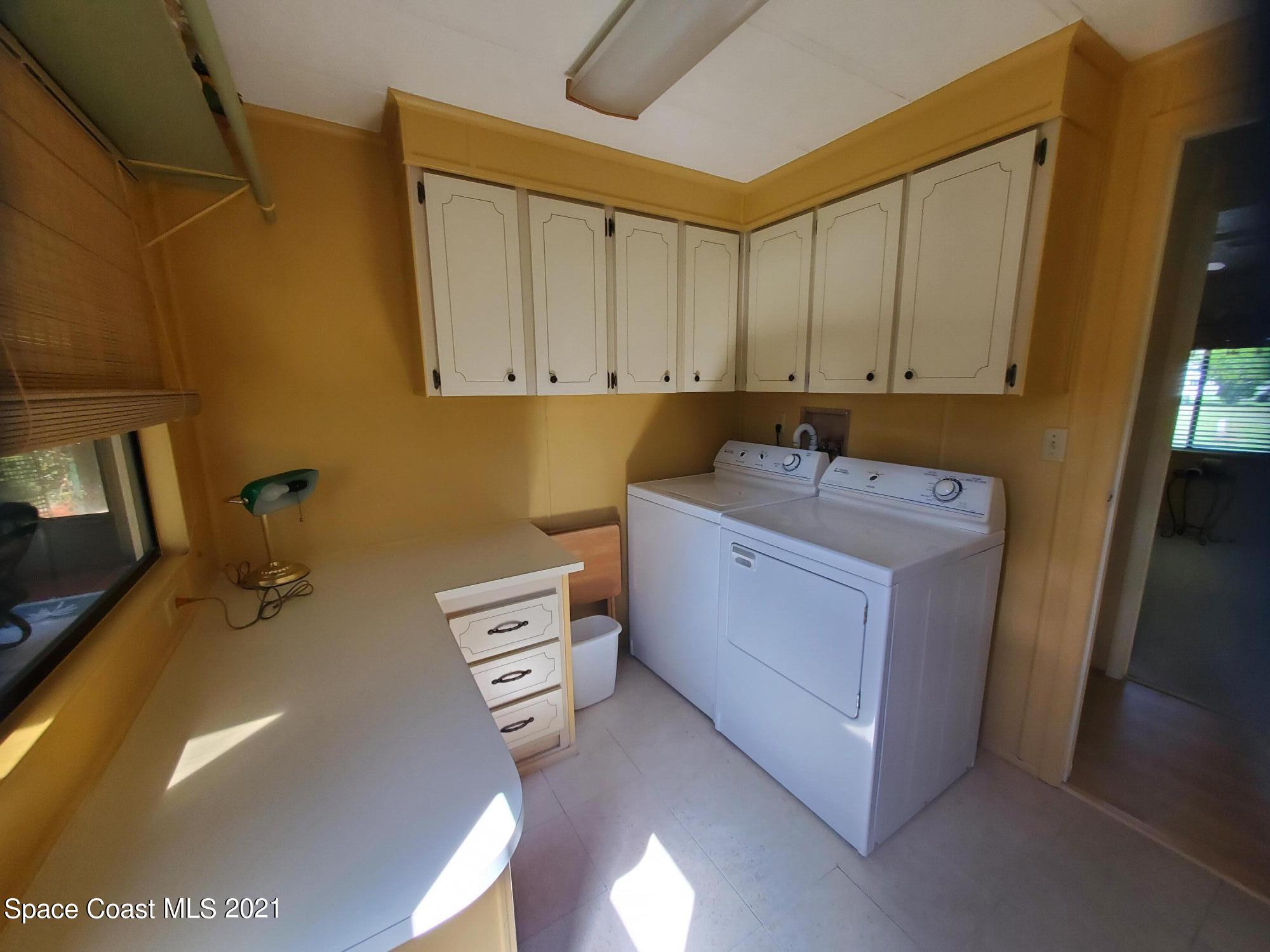 327 Macadamia Drive Sebastian, FL 32976 - Photo 26 of 31 a utility room with dryer and washer