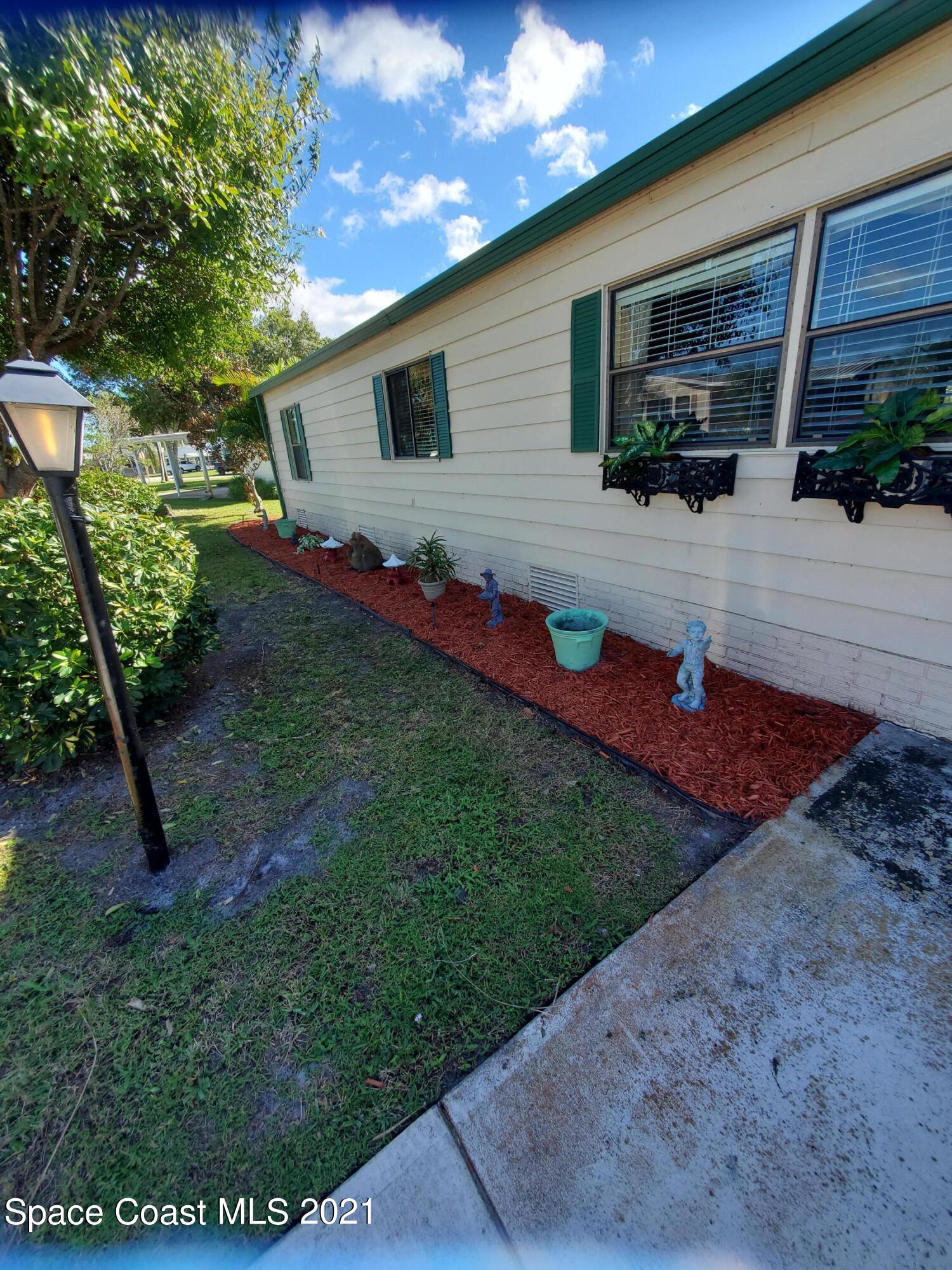 327 Macadamia Drive Sebastian, FL 32976 - Photo 29 of 31 a view of backyard of the house