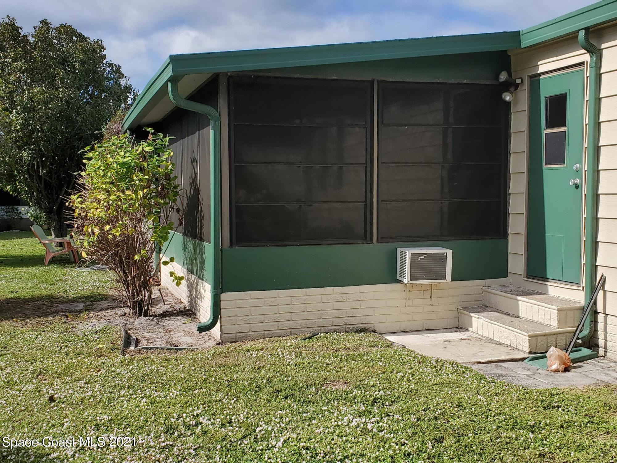 327 Macadamia Drive Sebastian, FL 32976 - Photo 31 of 31 a view of a house with a yard