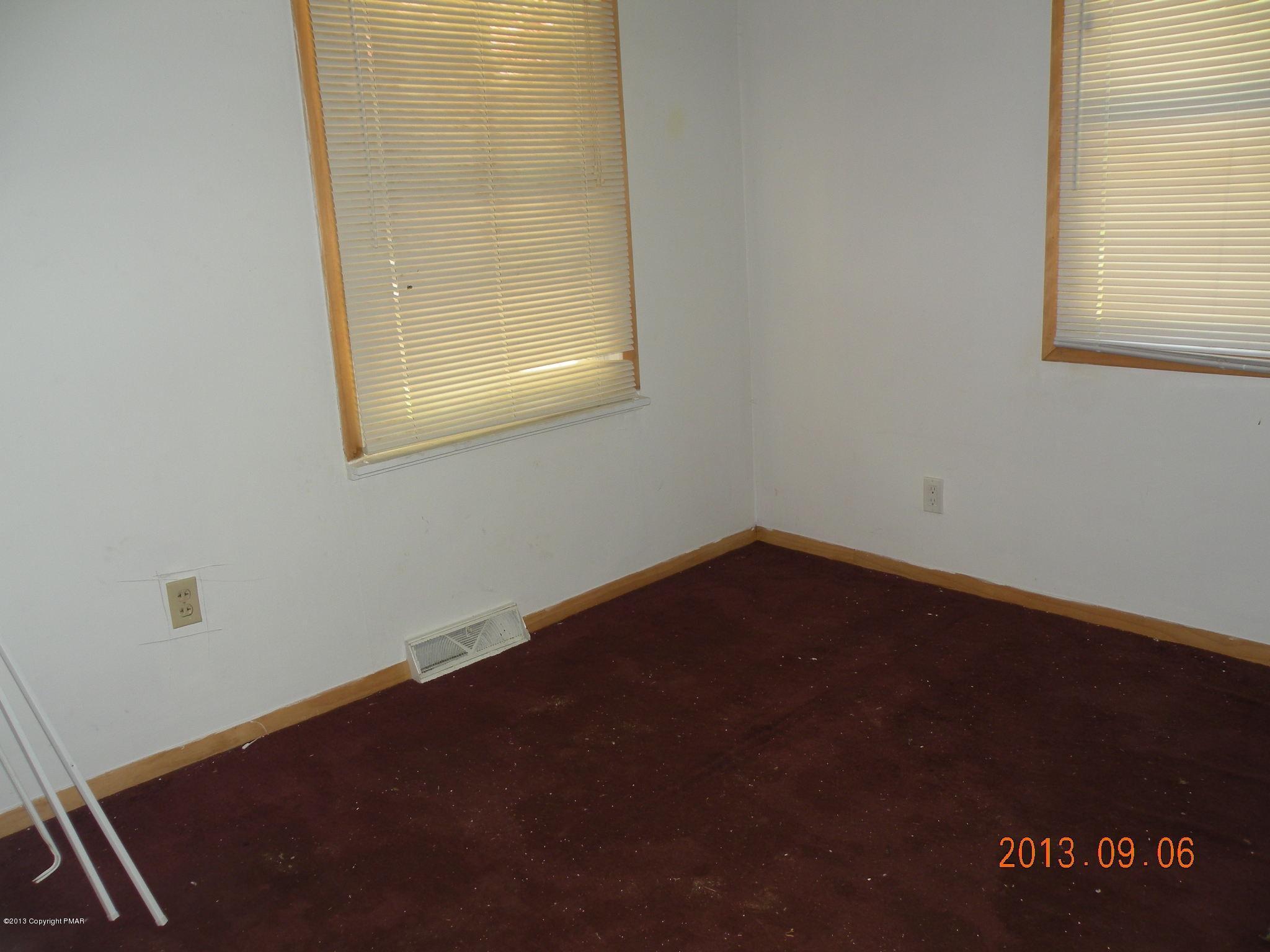 504 Eastbrook Road Effort, PA 18330 - Photo 5 of 10 an empty room with a window