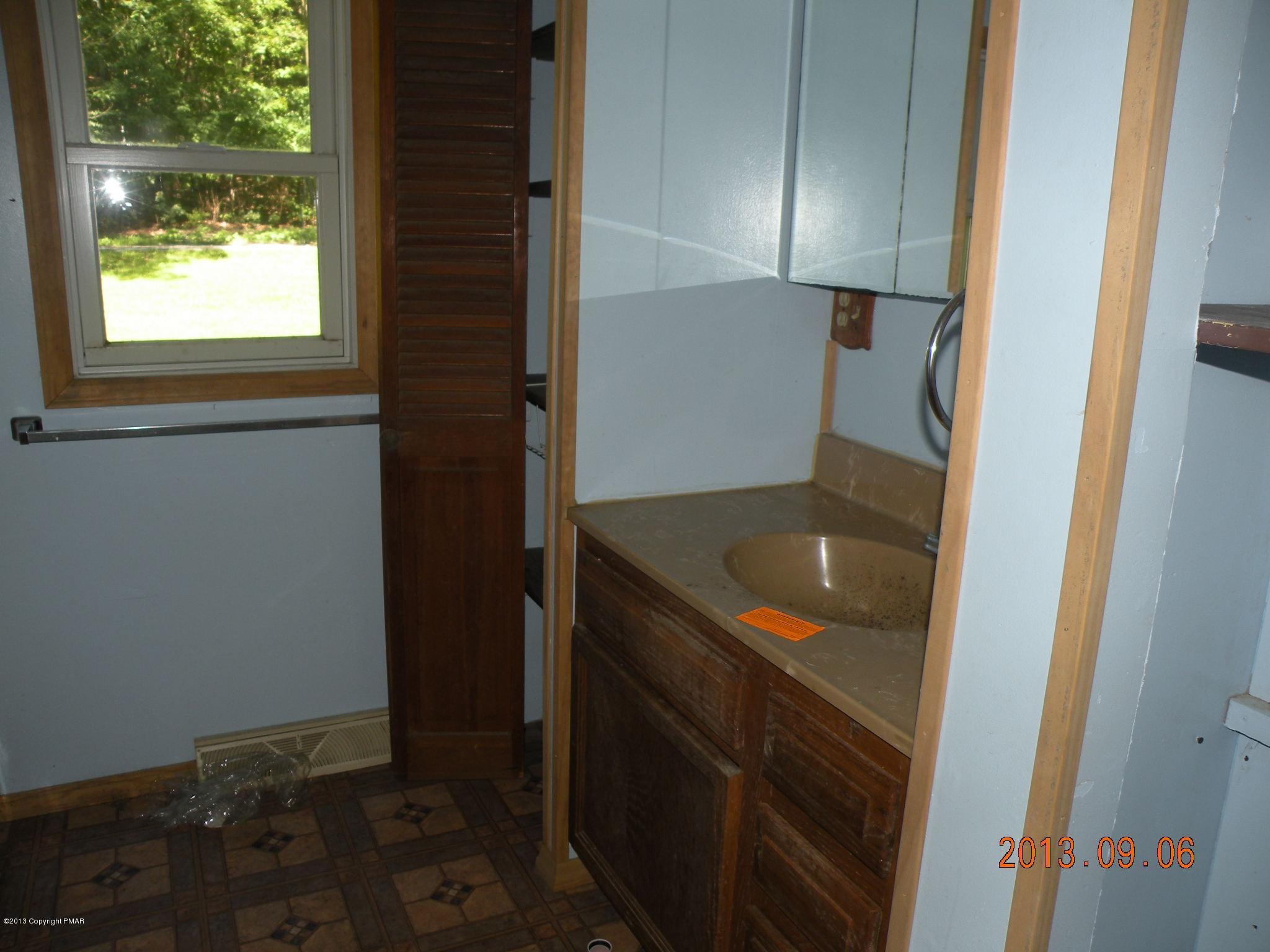 504 Eastbrook Road Effort, PA 18330 - Photo 9 of 10 a bathroom with a sink and a mirror