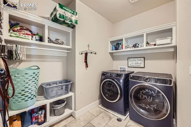 a utility room with closet dryer and washer