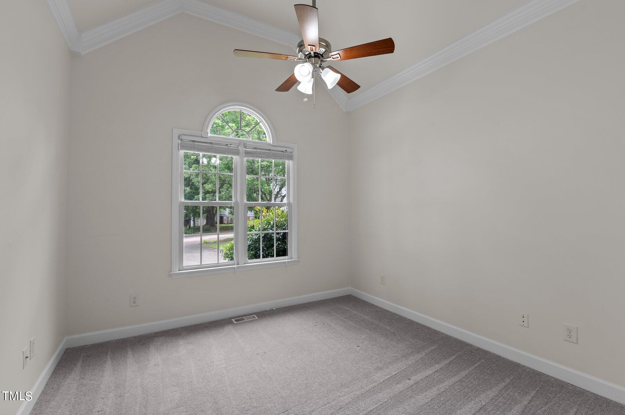 604 Middle Bridge Road Wake Forest, NC 27587 - Photo 13 of 48 an empty room with a window and a fan