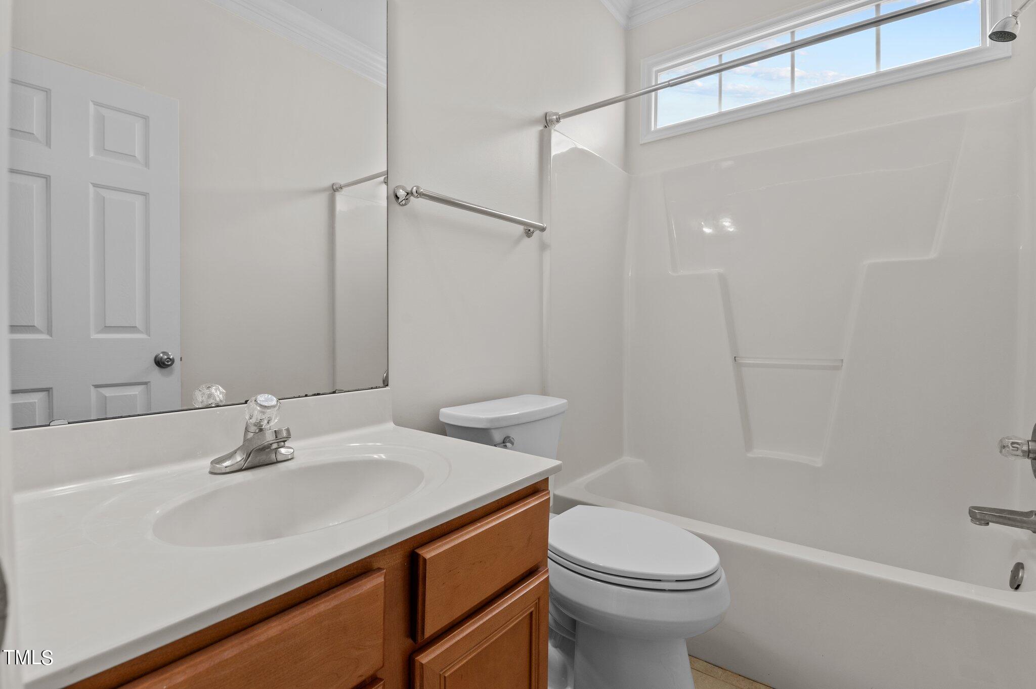 604 Middle Bridge Road Wake Forest, NC 27587 - Photo 14 of 48 a bathroom with a sink toilet and shower