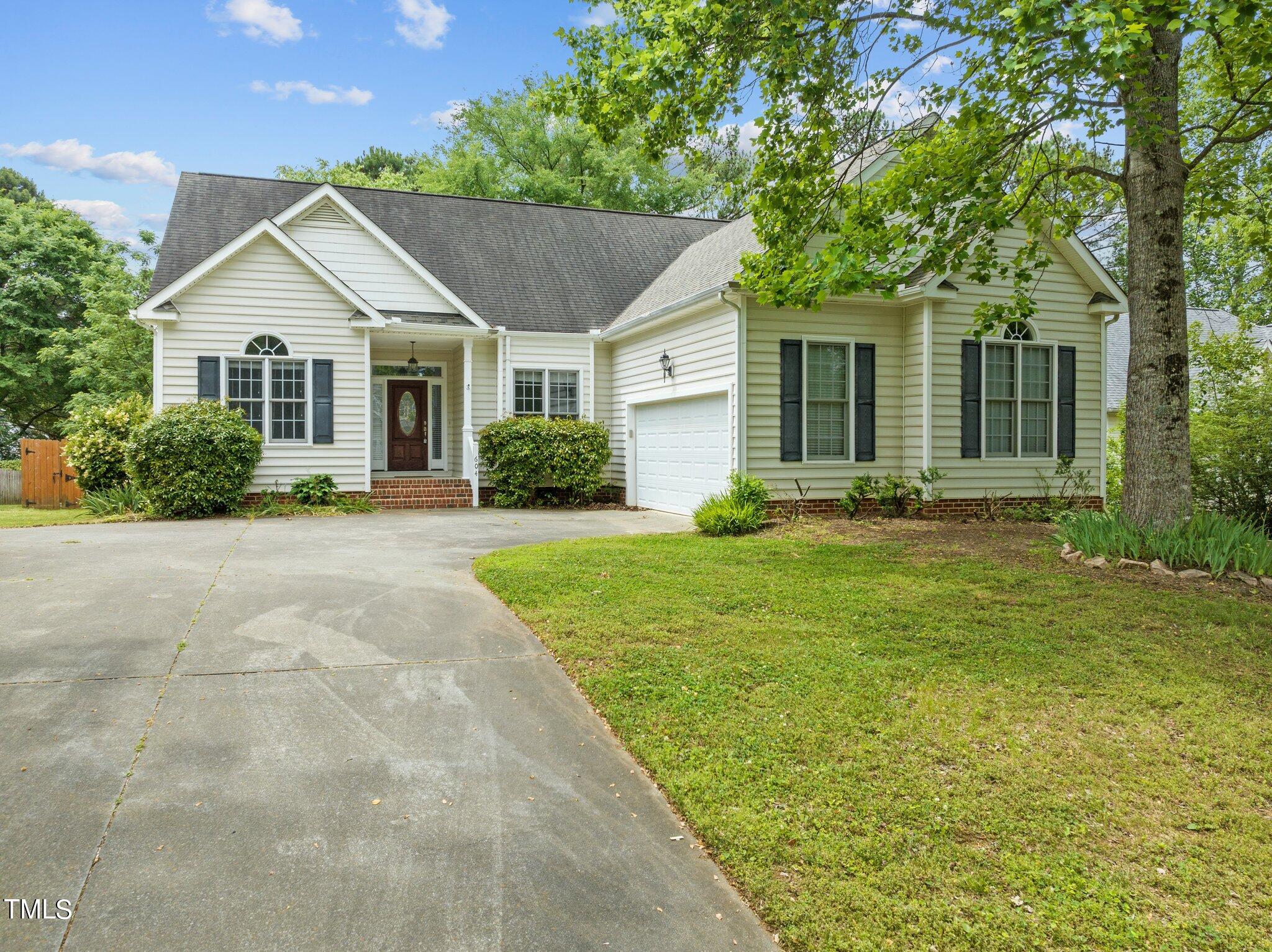604 Middle Bridge Road Wake Forest, NC 27587 - Photo 2 of 48 a front view of house with yard and green space