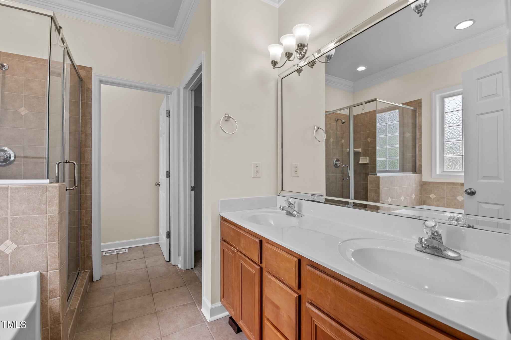 604 Middle Bridge Road Wake Forest, NC 27587 - Photo 23 of 48 a bathroom with a sink double vanity and a mirror