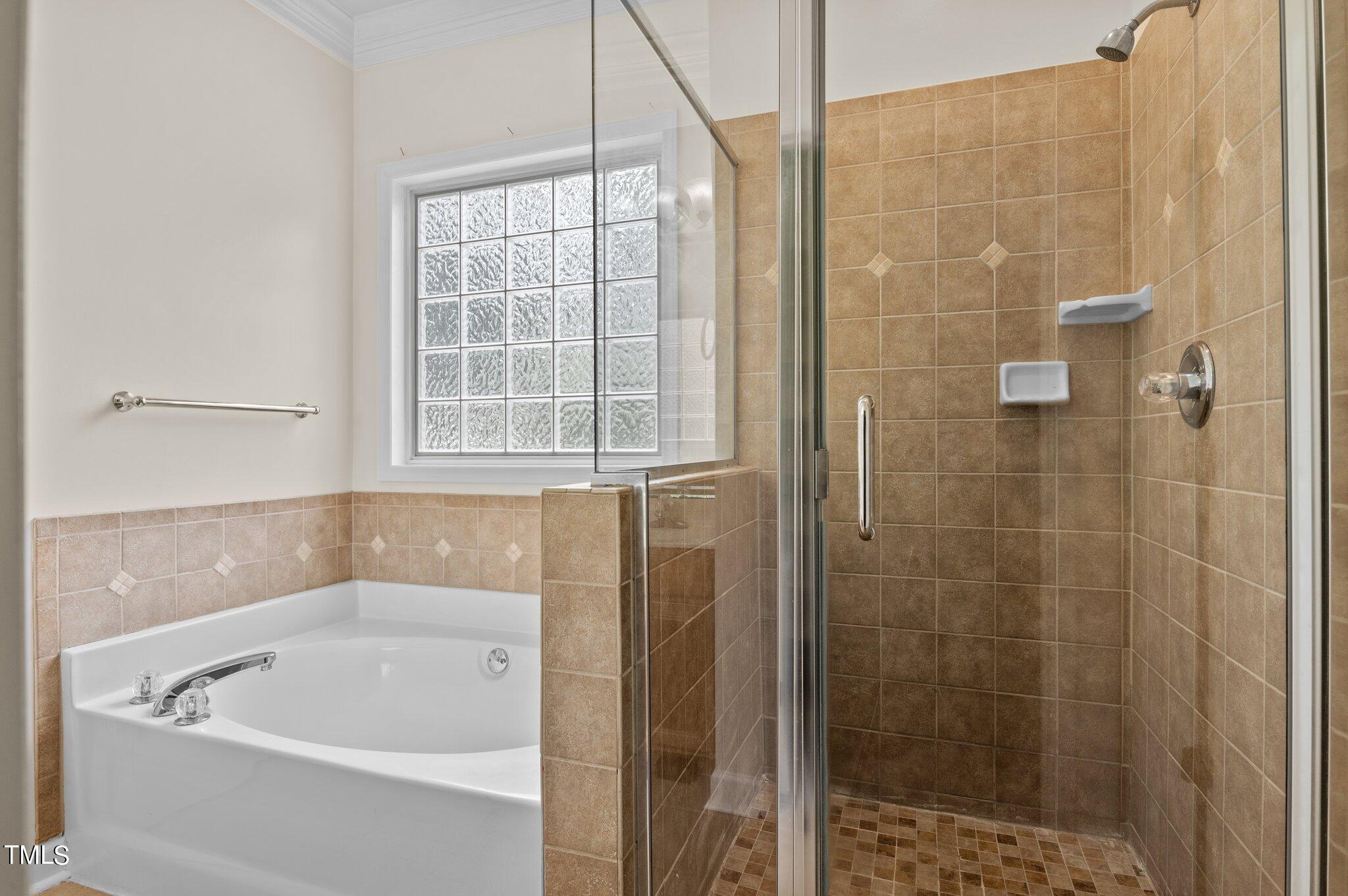 604 Middle Bridge Road Wake Forest, NC 27587 - Photo 24 of 48 a bathroom with a bath tub and shower