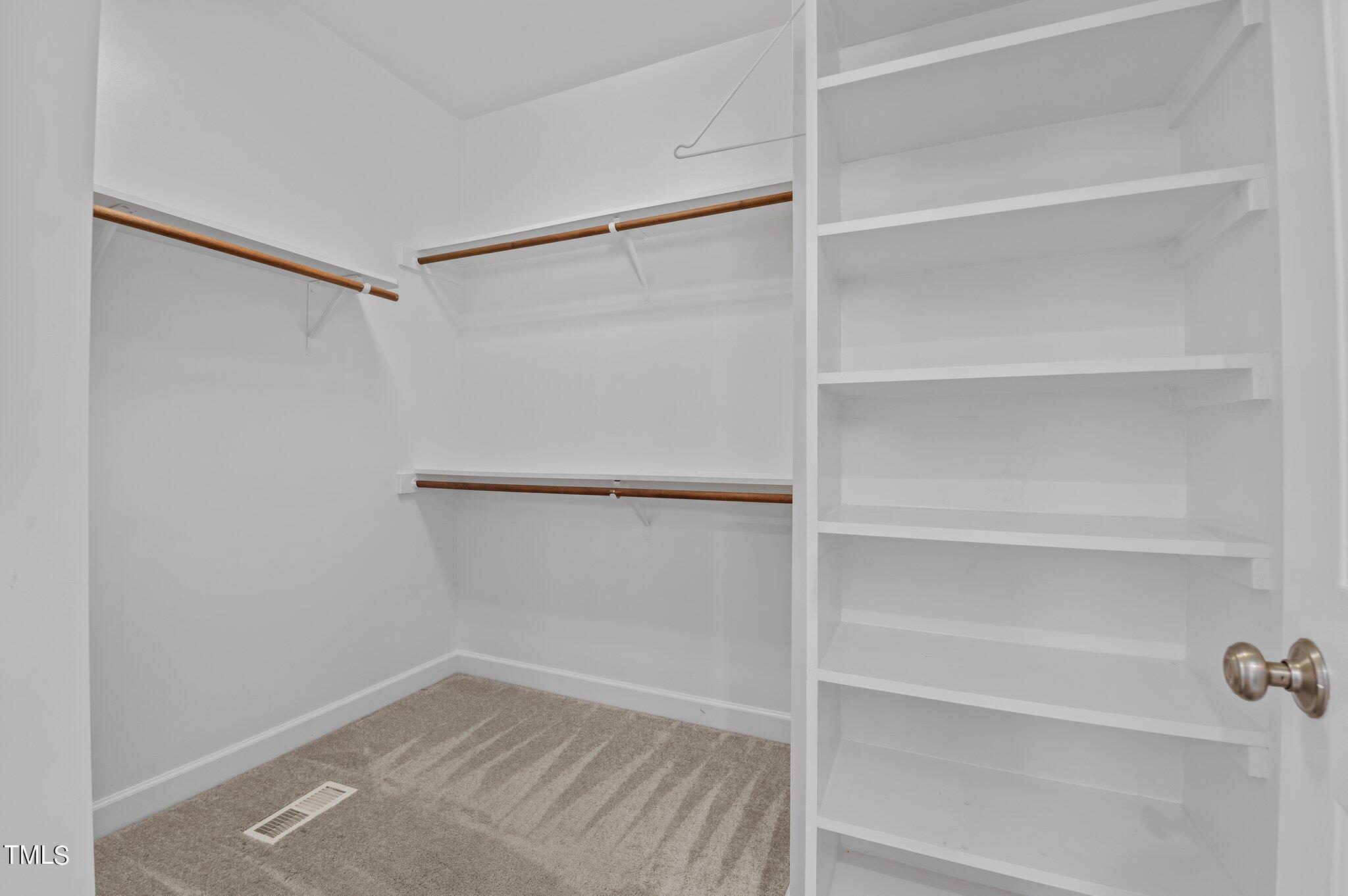 604 Middle Bridge Road Wake Forest, NC 27587 - Photo 26 of 48 a view of an empty walk in closet