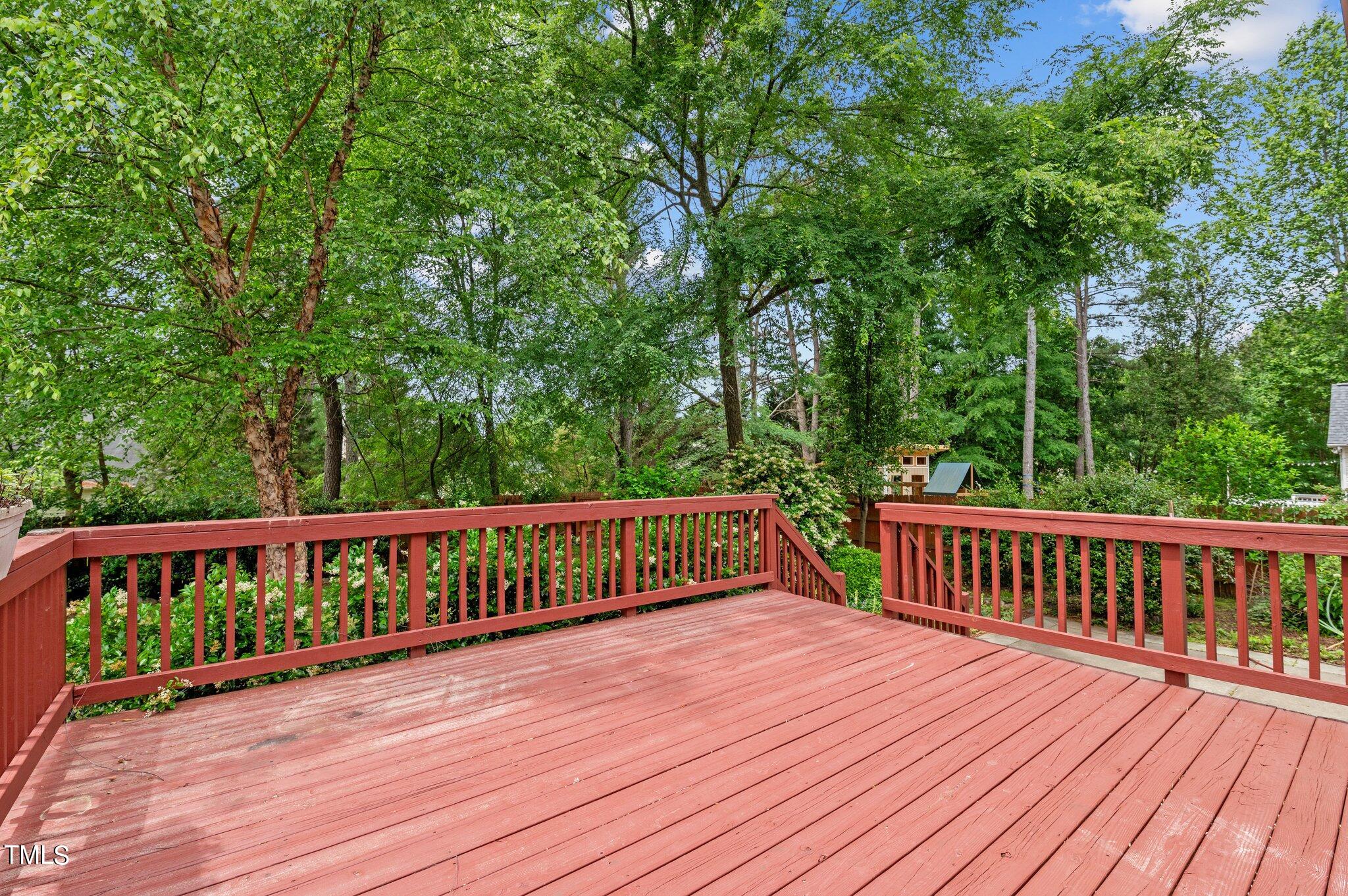 604 Middle Bridge Road Wake Forest, NC 27587 - Photo 30 of 48 a view of wooden deck and a garden