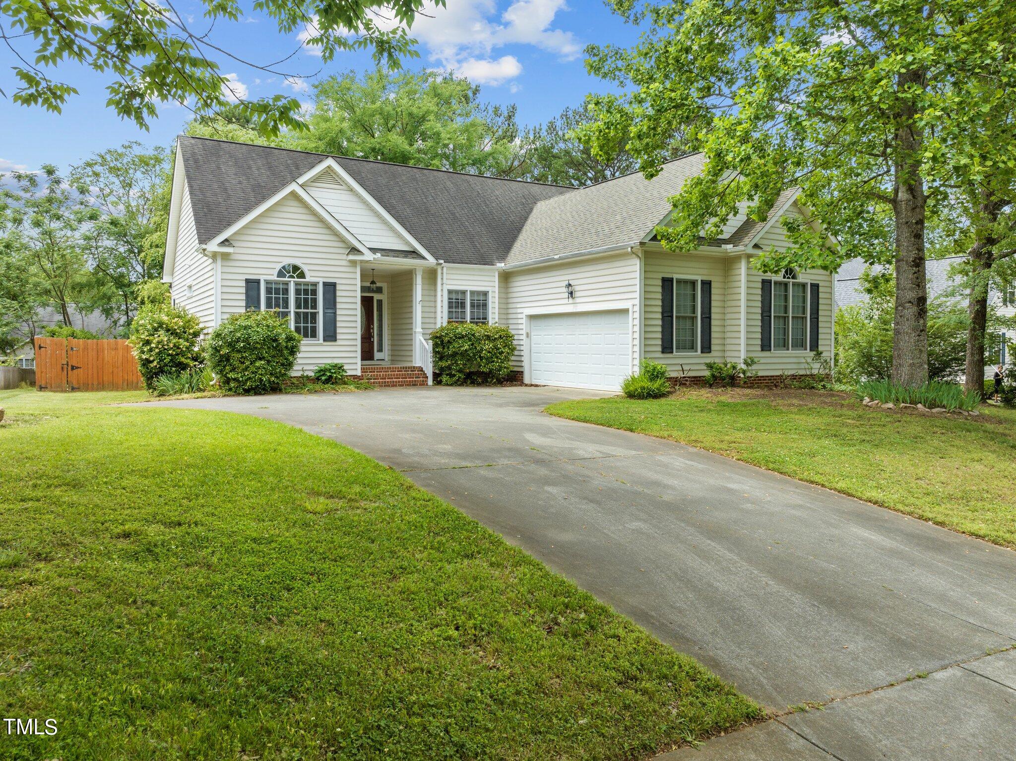 604 Middle Bridge Road Wake Forest, NC 27587 - Photo 3 of 48 a front view of a house with yard and green space