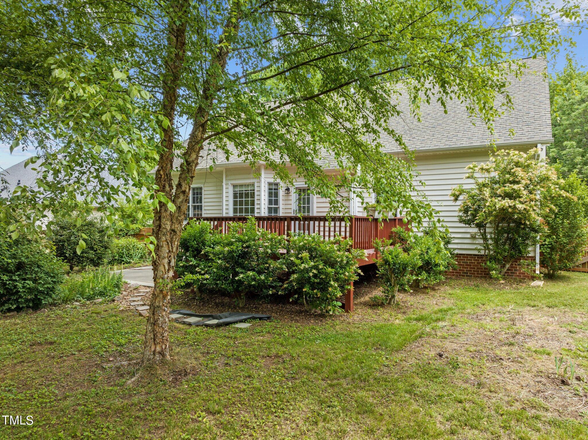 604 Middle Bridge Road Wake Forest, NC 27587 - Photo 36 of 48 a front view of a house with garden