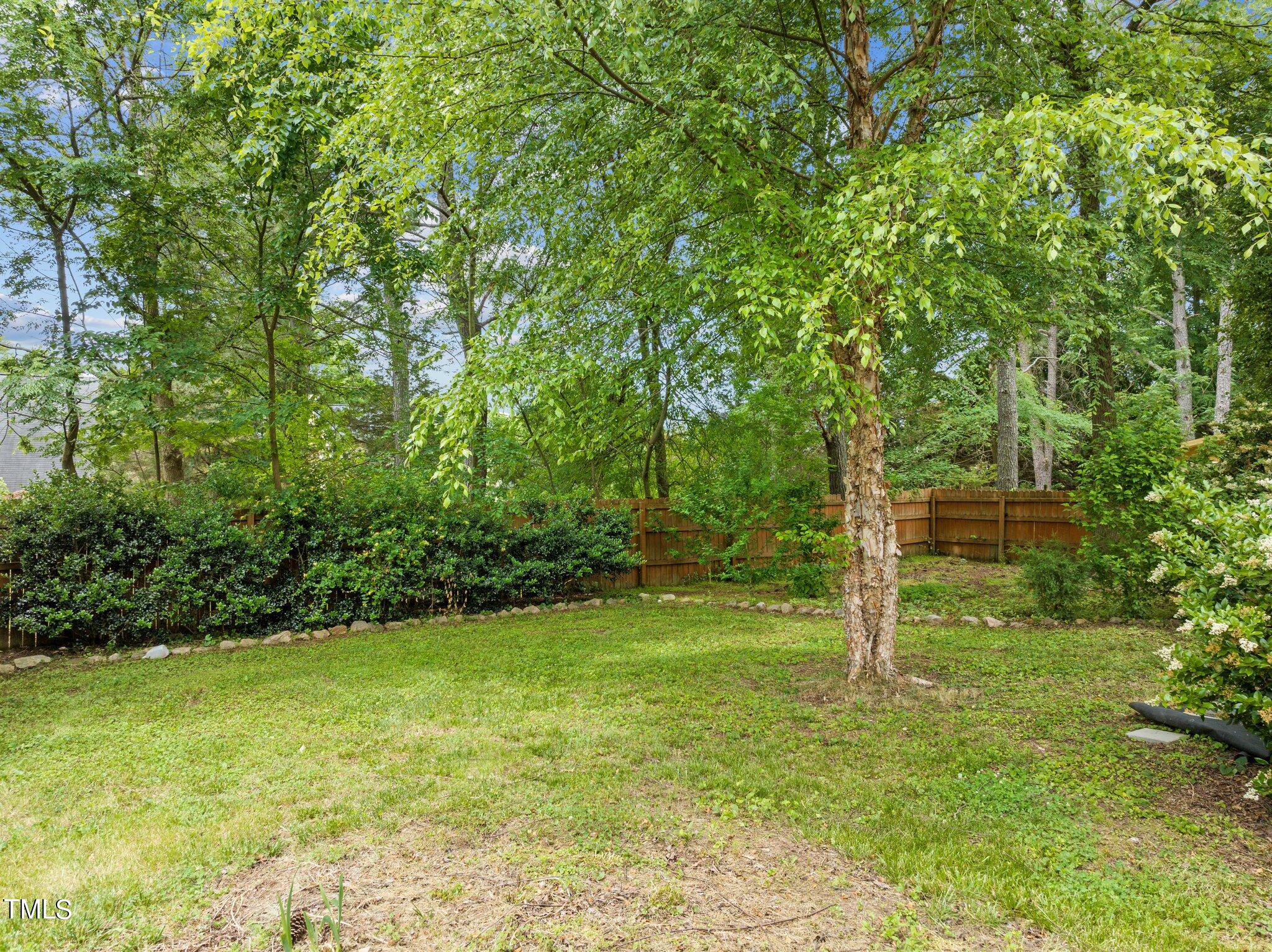 604 Middle Bridge Road Wake Forest, NC 27587 - Photo 38 of 48 a view of a trees with a yard