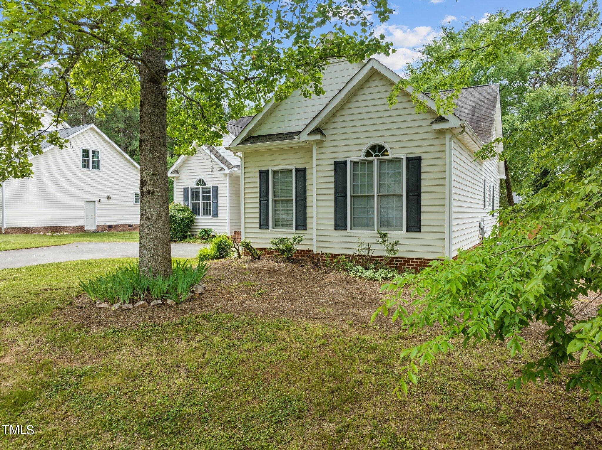 604 Middle Bridge Road Wake Forest, NC 27587 - Photo 41 of 48 a front view of a house with garden