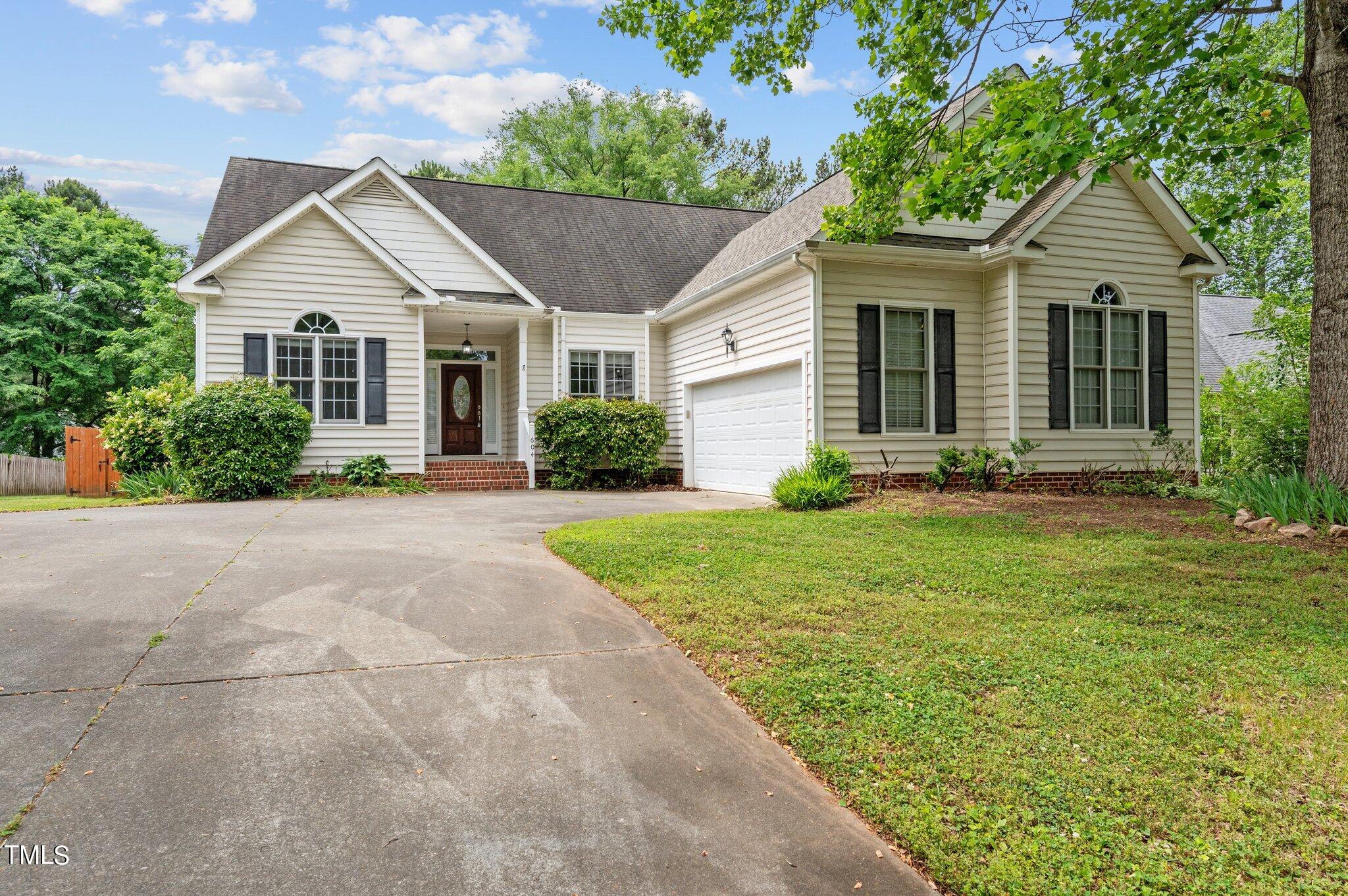604 Middle Bridge Road Wake Forest, NC 27587 - Photo 43 of 48 a front view of a house with garden