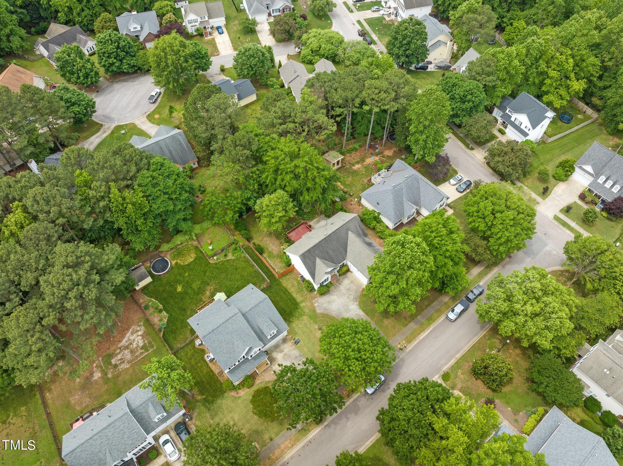 604 Middle Bridge Road Wake Forest, NC 27587 - Photo 47 of 48 an aerial view of a house with a yard