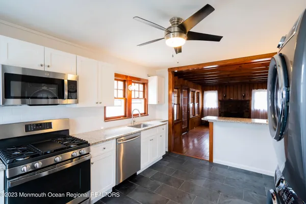 a kitchen with a stove and a microwave