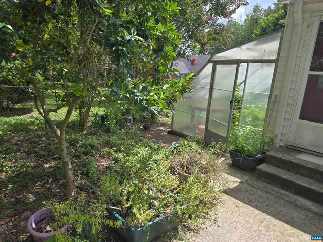 a backyard of a house with lots of green space