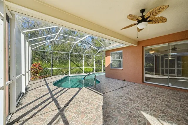 a view of a porch with a table and chairs