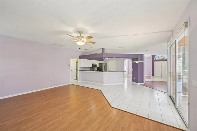 a view of a kitchen with wooden floor and a sink