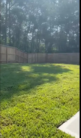 a view of a yard with a house