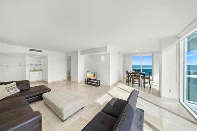 a view of a dining room with furniture window and outside view