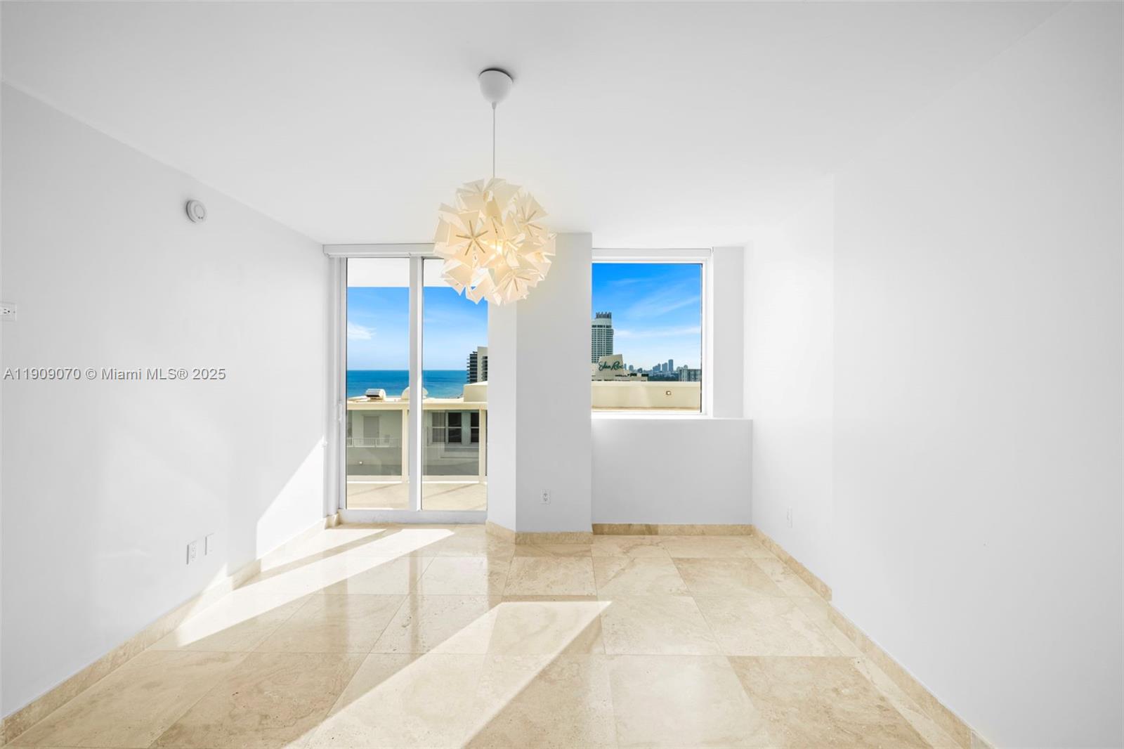 4775 Collins Avenue, Unit 1903 Miami Beach, FL 33140 - Photo 31 of 49 a view of a room with a chandelier