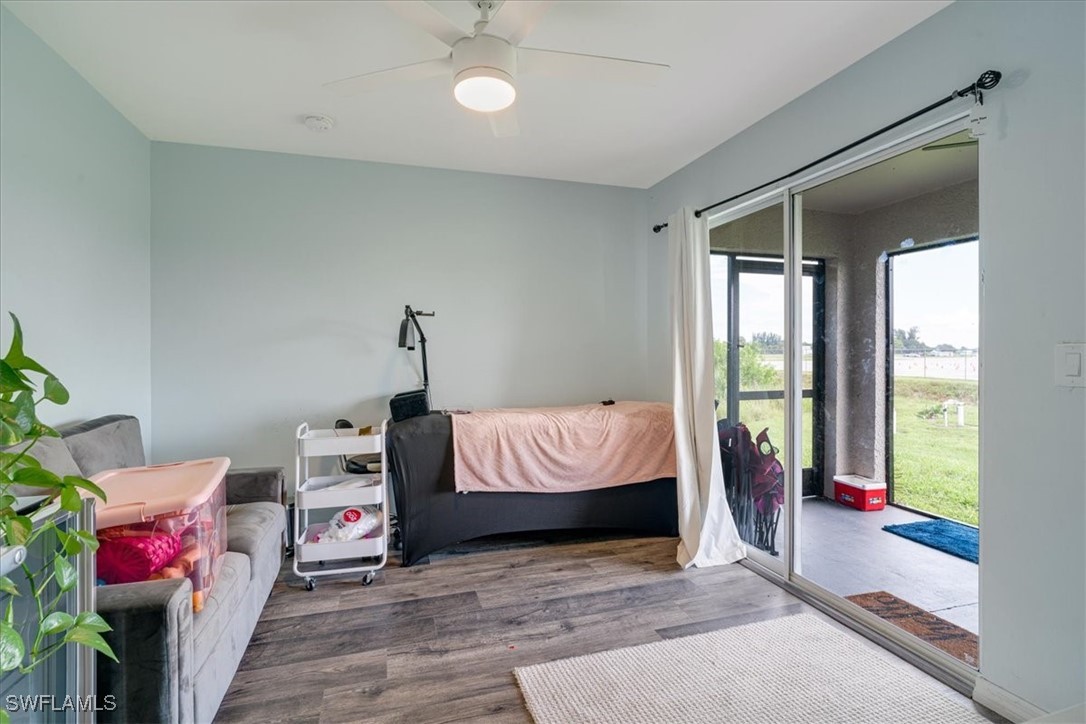 3980 Sunset Road Lehigh Acres, FL 33971 - Photo 9 of 42 a bedroom with a bed and a window