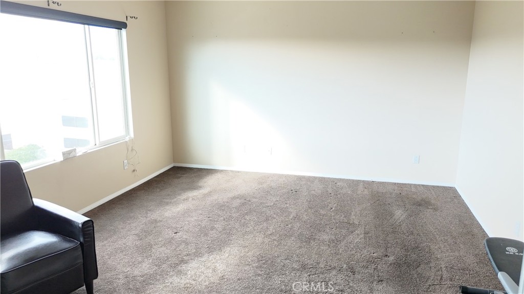 176 Nightfall Road San Jacinto, CA 92582 - Photo 7 of 11 a view of an empty room and window