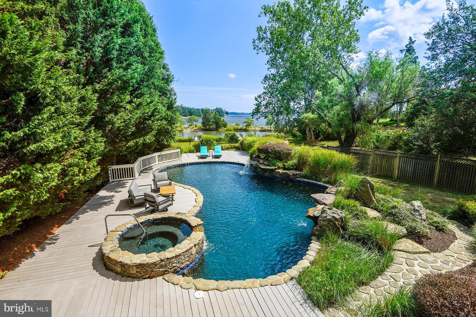 421 Ferry Point Road Annapolis, MD 21403 - Photo 3 of 51 Free-form pool has an integral spa & 3 waterfalls