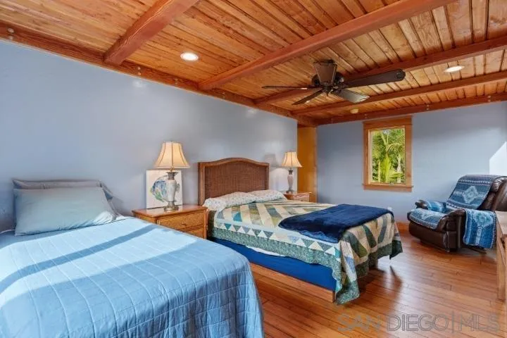 3097 Green Heather Lane Fallbrook, CA 92028 - Photo 20 of 37 a bedroom with furniture and a window