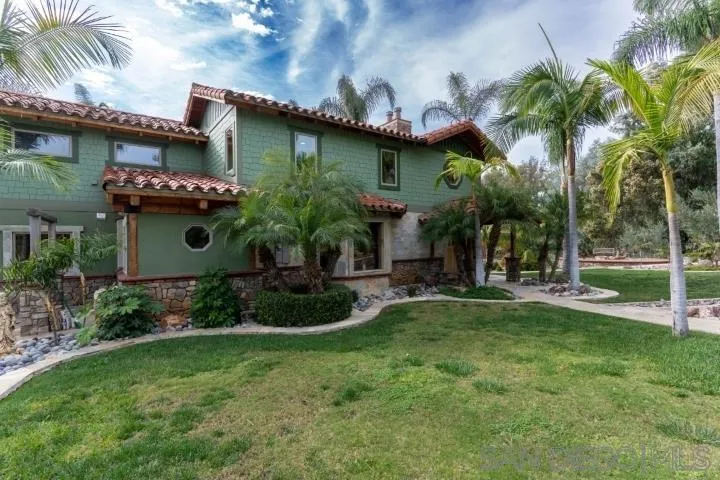 3097 Green Heather Lane Fallbrook, CA 92028 - Photo 30 of 37 a front view of a house with garden