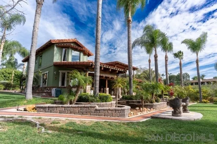 3097 Green Heather Lane Fallbrook, CA 92028 - Photo 33 of 37 a front view of a house with a garden