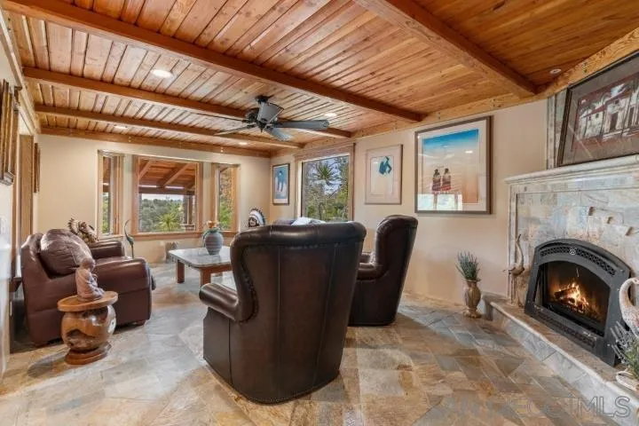 3097 Green Heather Lane Fallbrook, CA 92028 - Photo 6 of 37 a living room with furniture and a fireplace