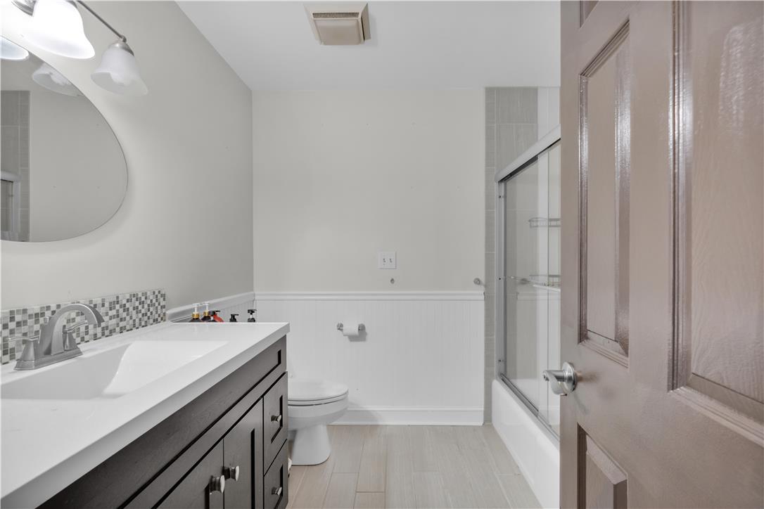 3396 Darien Road Bethlehem, PA 18020 - Photo 21 of 44 A well-appointed bathroom with a sleek vanity and a combination tub-shower.