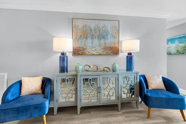 a bedroom with furniture and a lamp