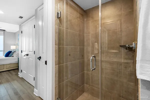 a bathroom with a shower and a tub