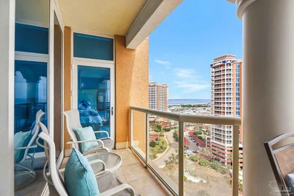a view of a balcony with furniture