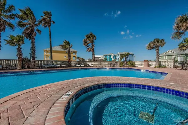 a swimming pool with outdoor seating and yard