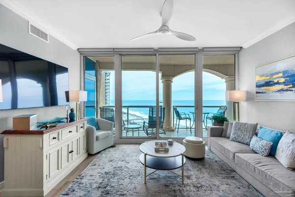 a living room with furniture and a large window