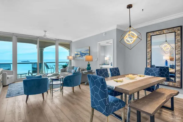 a view of a dining room with furniture window and wooden floor