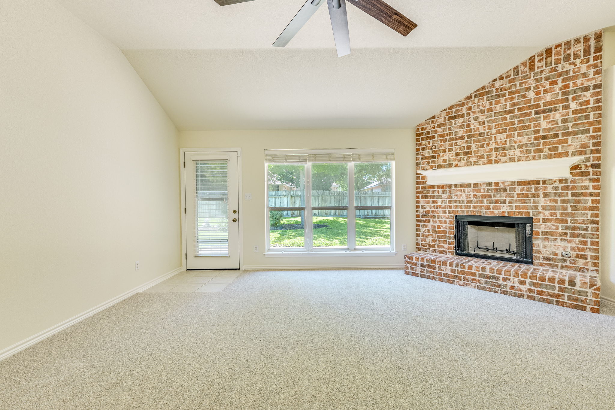 111 Arrowhead Lane Georgetown, TX 78628 - Photo 16 of 40 a view of empty room with a fireplace