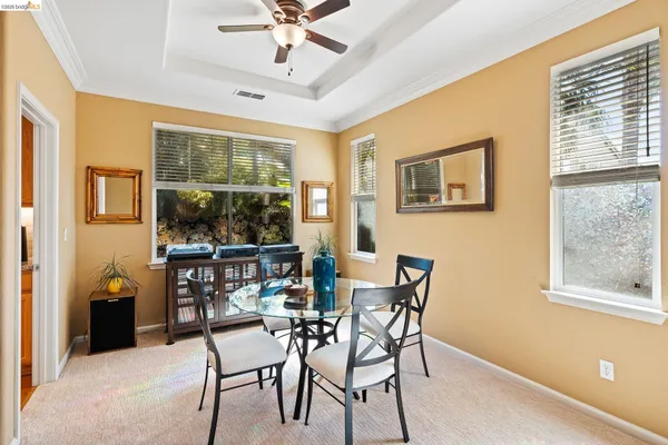 a kitchen with stainless steel appliances kitchen island granite countertop a sink and counter space