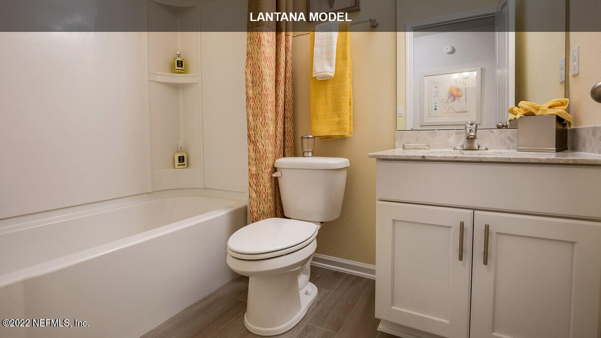 65696 Edgewater Drive Yulee, FL 32097 - Photo 15 of 44 a bathroom with a sink toilet and shower