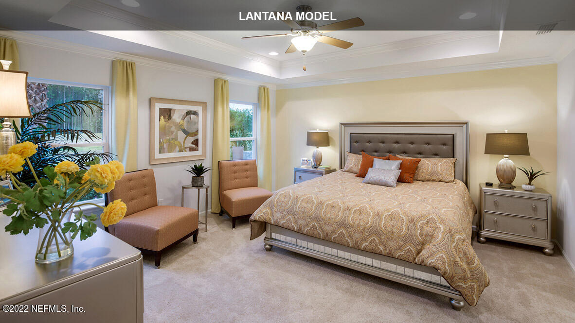 65696 Edgewater Drive Yulee, FL 32097 - Photo 8 of 44 a bedroom with bed and a couch