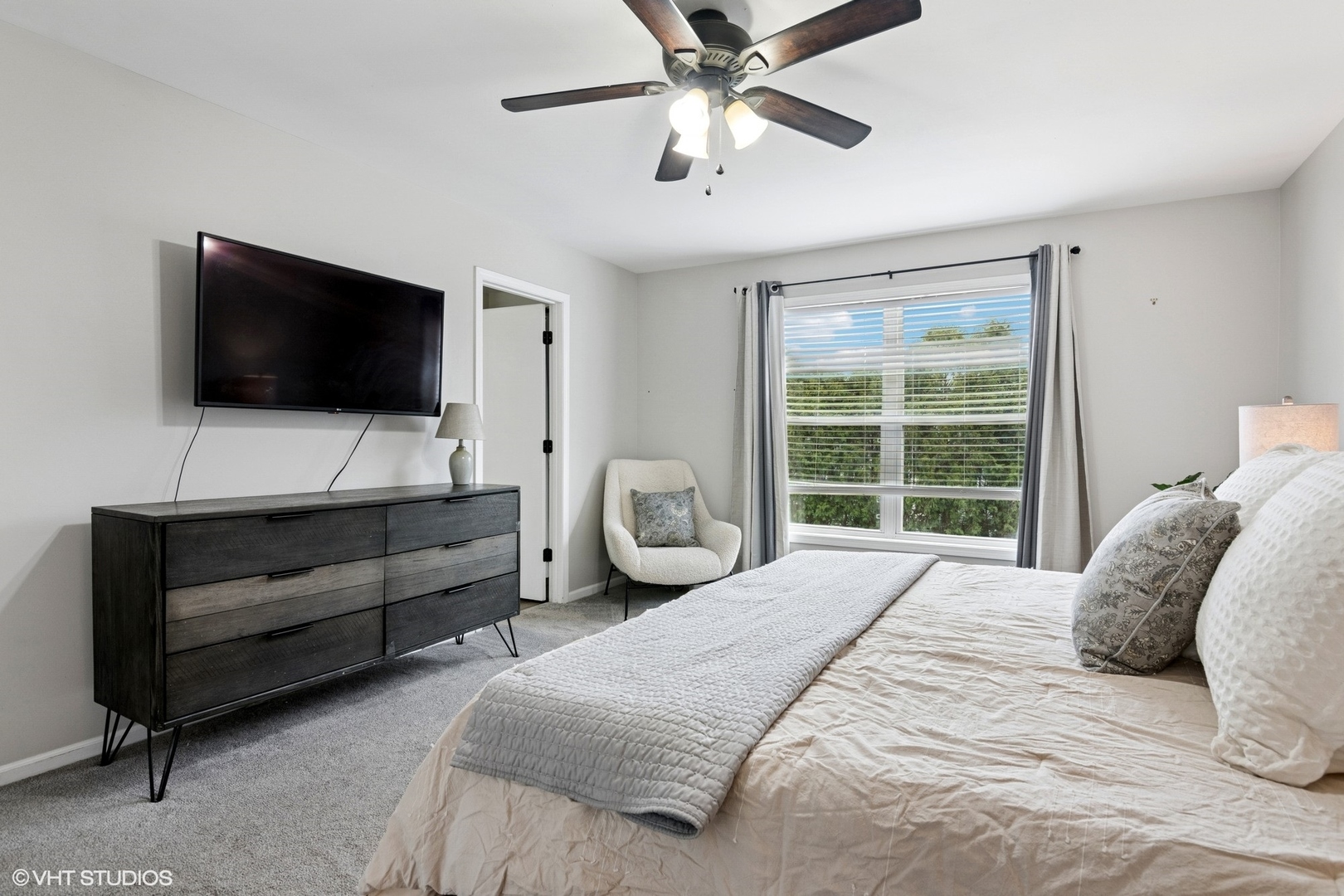 2421 Deerfield Drive Aurora, IL 60506 - Photo 12 of 22 a bedroom with a bed a window and a flat screen television