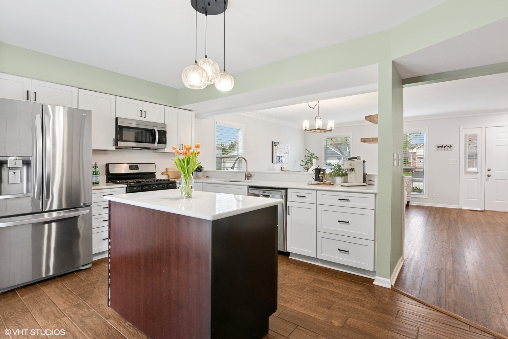 2421 Deerfield Drive Aurora, IL 60506 - Photo 5 of 22 a kitchen with kitchen island white cabinets and stainless steel appliances