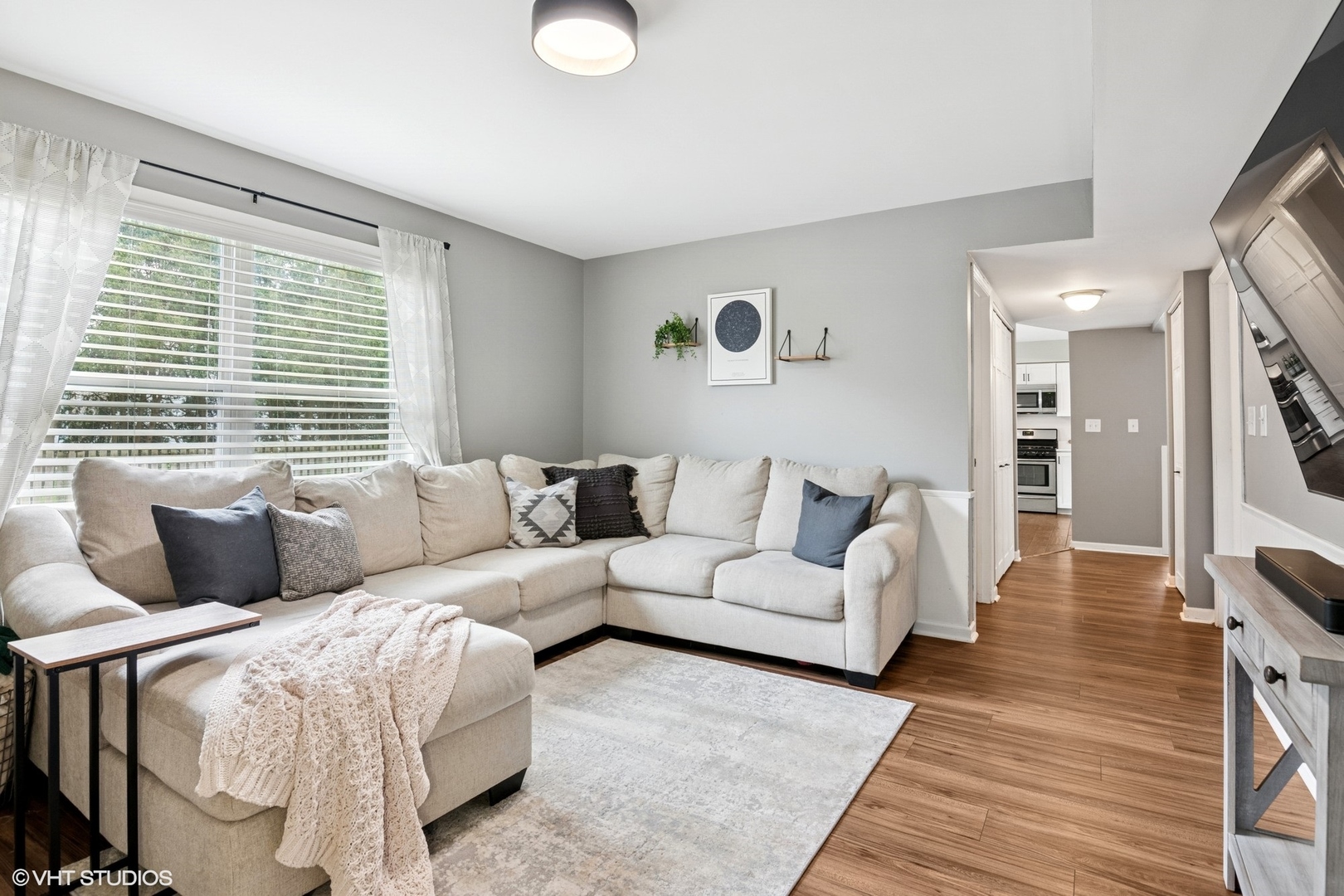2421 Deerfield Drive Aurora, IL 60506 - Photo 9 of 22 a living room with furniture and a large window